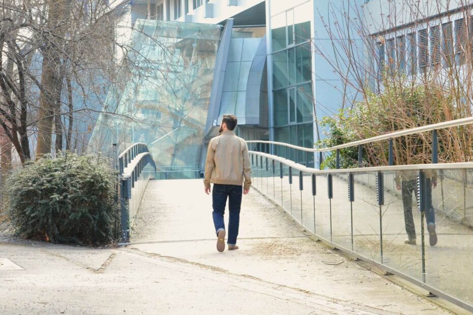 Model with sustainable classic jeans walks away