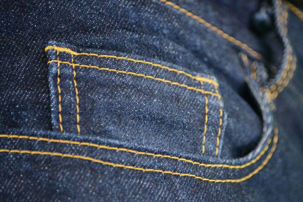 close up jeans pocket stitching